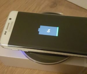 White Galaxy S6 Edge with Samsung Wireless Charging Pad